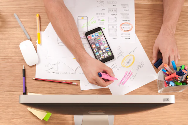 A marketer planning ad campaigns at a desk
